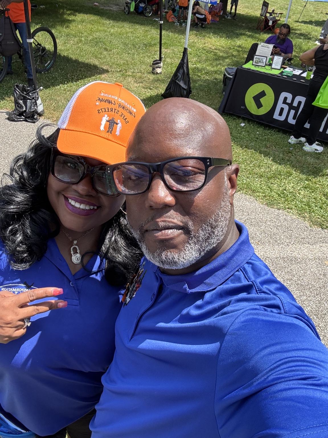Damiasi Smith with a community partner at an outdoor Baltimore event