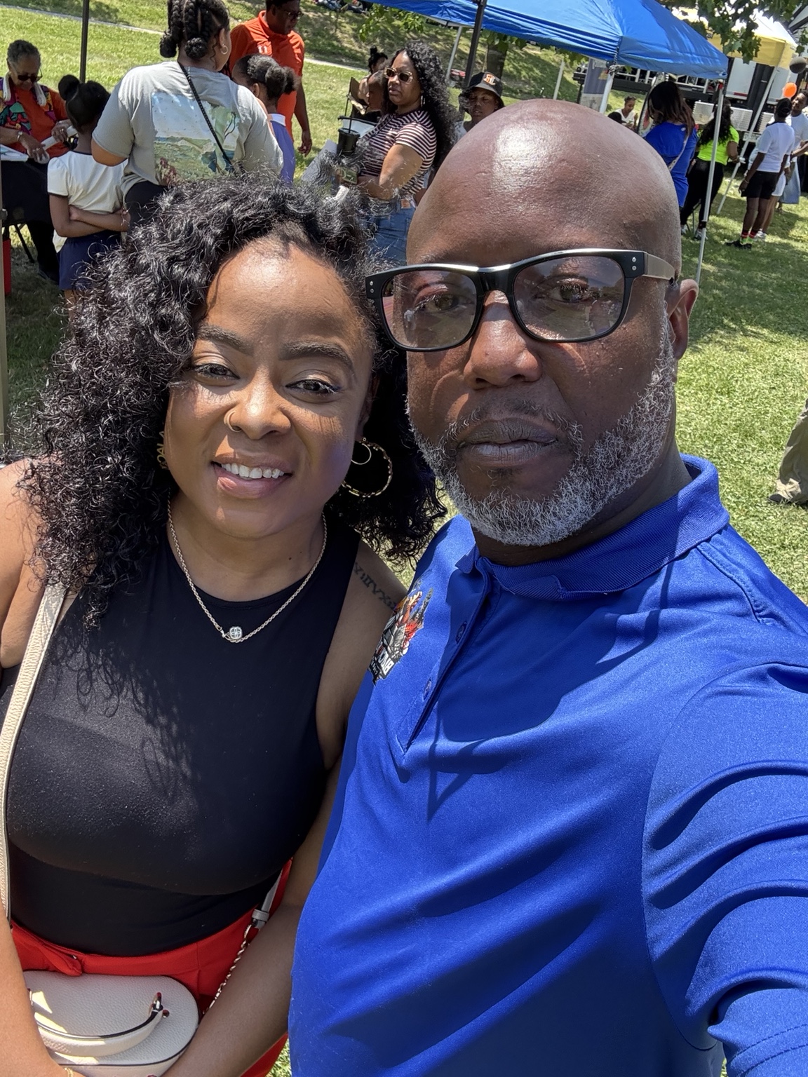 Damiasi Smith connecting with a resident at a Baltimore community event